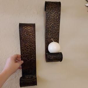 Pair of metal scrolled candle holders